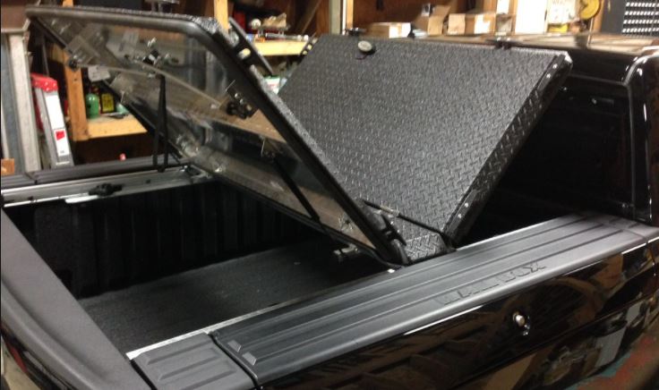 truck bed cover with a truck bed liner